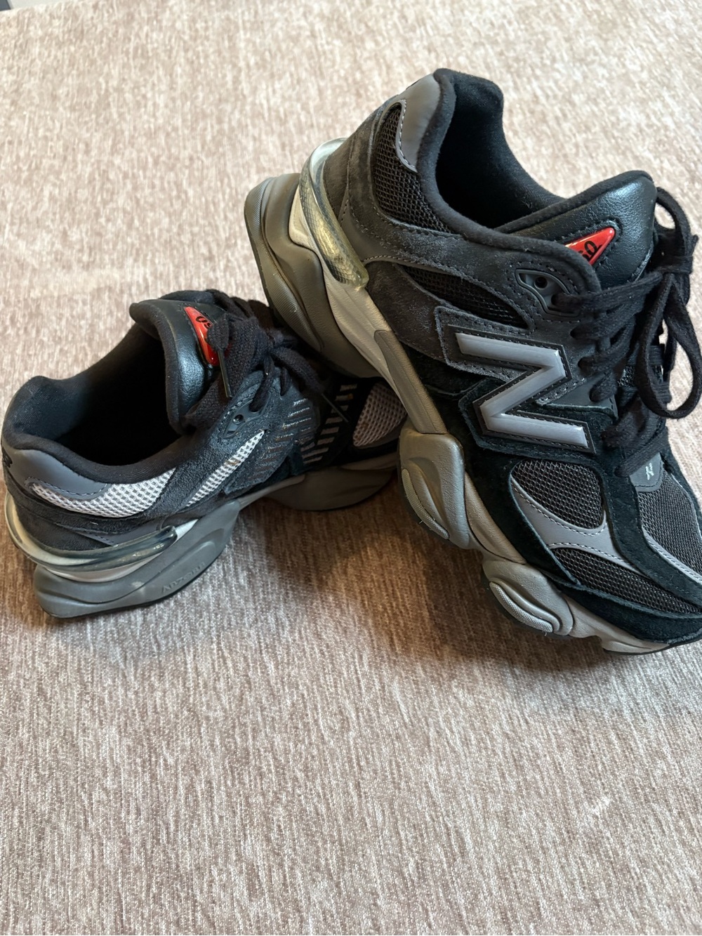 New Balance Men's Black and Gray Runner Sneakers with Red Tongue Accent